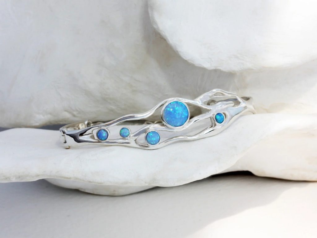 gw bng 001 wave bangle blue opals styled stone cradle