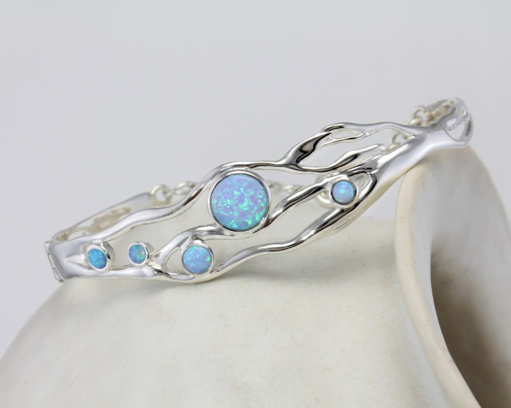 gw bng 001 wave bangle blue opals styled stone side
