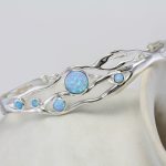 gw bng 001 wave bangle blue opals styled stone side