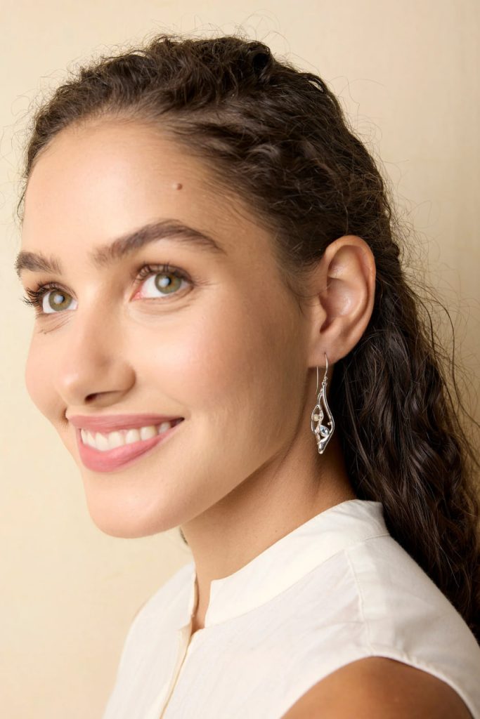 gw ear 001 sculptural leaf drop earrings pearl blue topaz model portrait