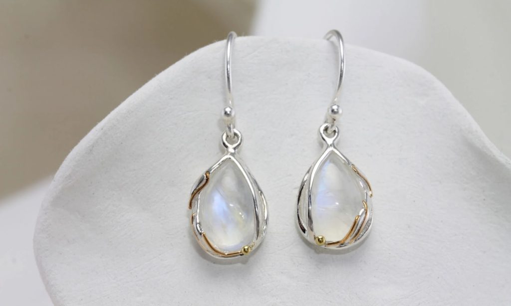 gw ear 002 teardrop earrings rainbow moonstone styled cushion 1