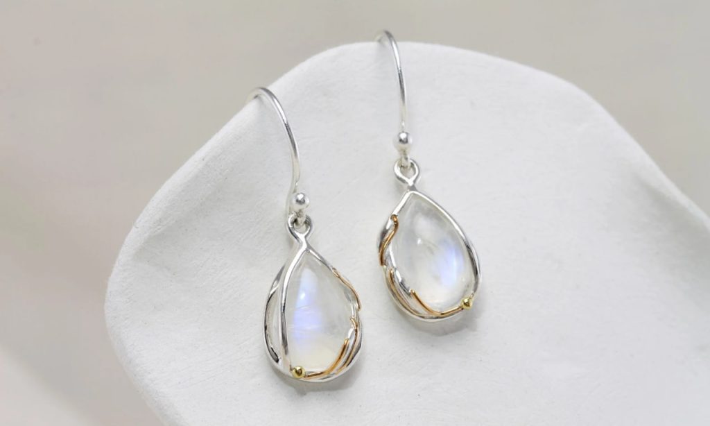 gw ear 002 teardrop earrings rainbow moonstone styled cushion 2